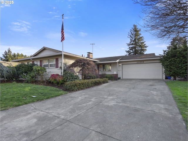 single story home featuring a garage and a front lawn