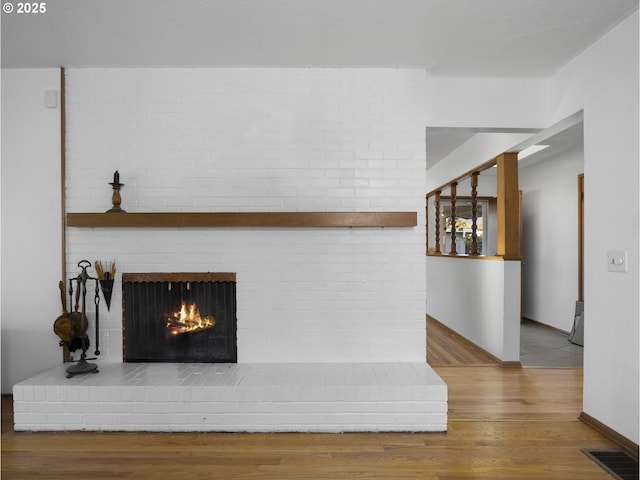 interior details with a fireplace and hardwood / wood-style floors