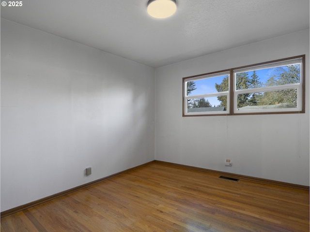 empty room featuring hardwood / wood-style floors