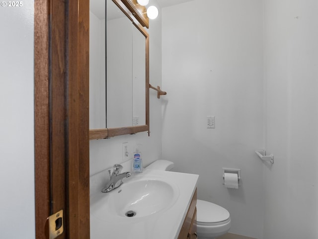 bathroom with toilet and vanity