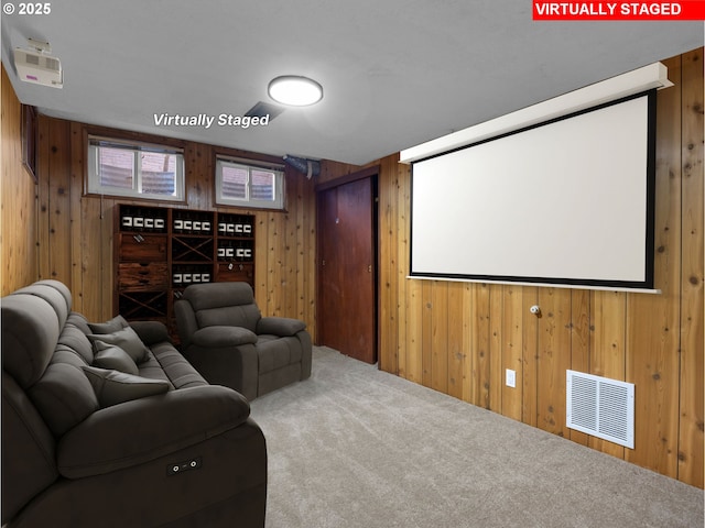 carpeted home theater with wood walls