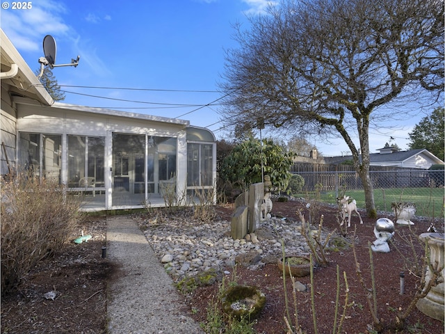 view of yard featuring a sunroom