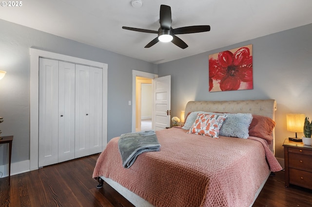 bedroom featuring a closet, dark wood-style flooring, and a ceiling fan