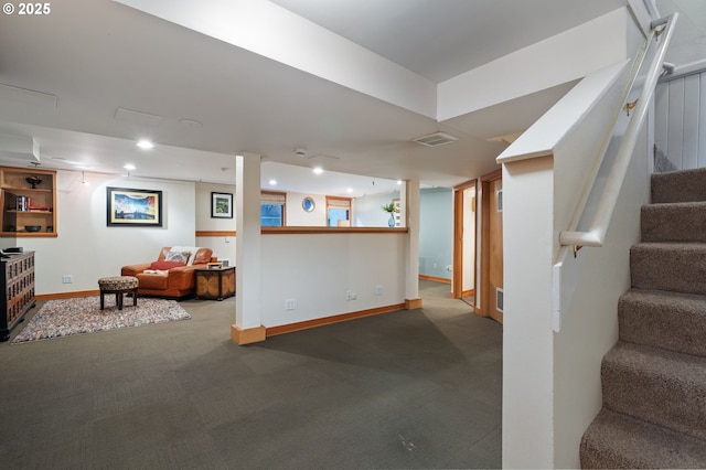 finished basement with stairway, baseboards, visible vents, and recessed lighting