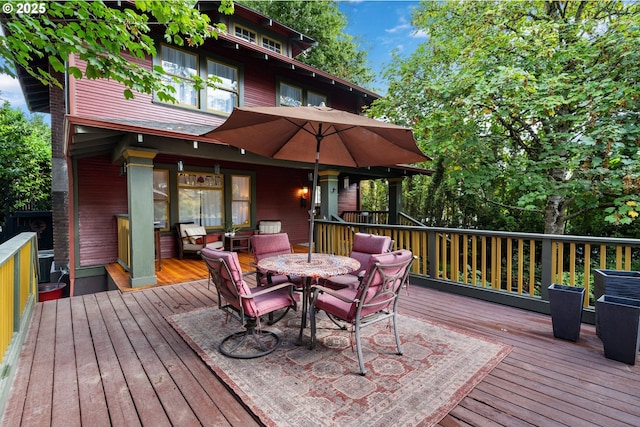 deck featuring outdoor dining area