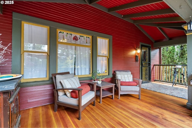 sunroom / solarium featuring wood ceiling and lofted ceiling with beams