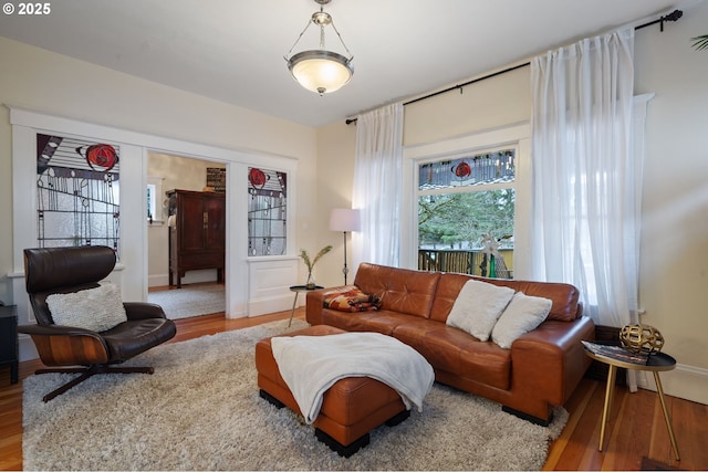 living room with baseboards and wood finished floors