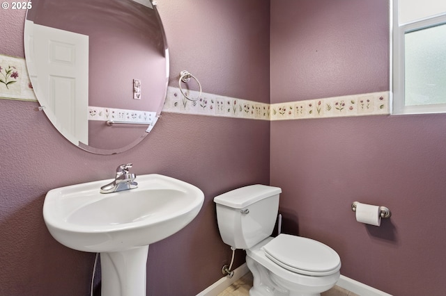 bathroom featuring sink and toilet