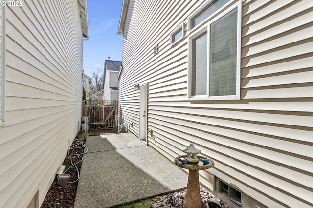 view of side of property featuring a patio