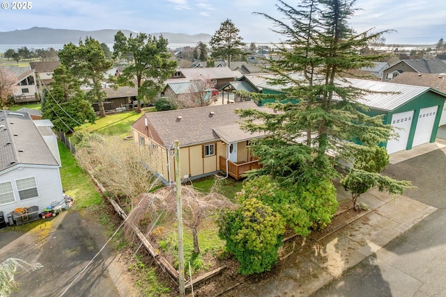 drone / aerial view featuring a mountain view and a residential view