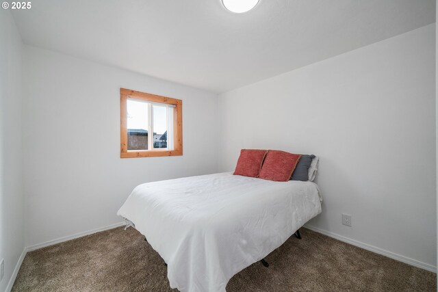 carpeted bedroom with baseboards