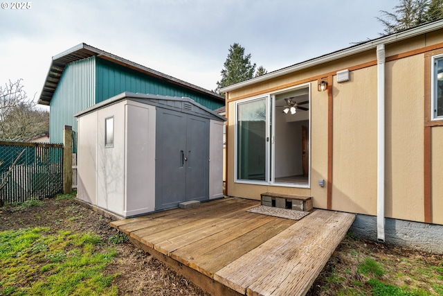 view of shed featuring fence