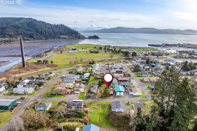 drone / aerial view with a residential view and a water view