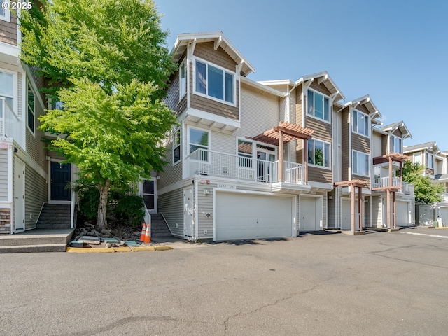 8620 SW 147th Ter Unit 101, Beaverton, OR 97007 - townhome / multi-family property featuring a garage, a residential view, and driveway