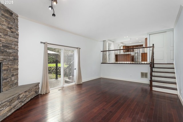 7134 SW 184th Pl, Beaverton, OR 97007 - unfurnished living room featuring wood-type flooring, ornamental molding, stairs, and a fireplace