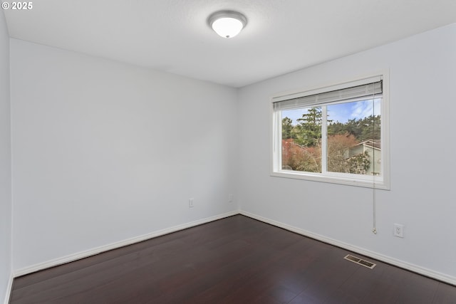 7134 SW 184th Pl, Beaverton, OR 97007 - empty room with baseboards and dark wood-type flooring