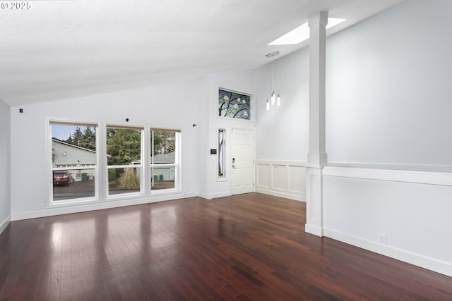 7134 SW 184th Pl, Beaverton, OR 97007 - entryway featuring ornate columns, hardwood / wood-style floors, and high vaulted ceiling