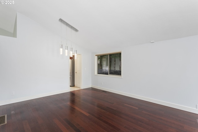 7134 SW 184th Pl, Beaverton, OR 97007 - unfurnished room featuring wood finished floors and vaulted ceiling