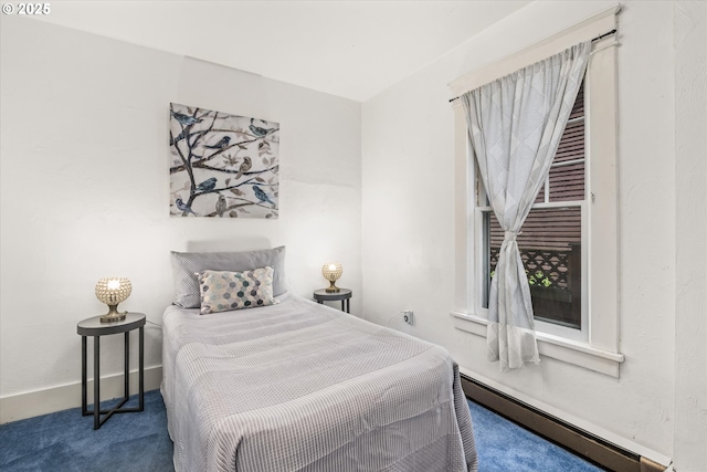 carpeted bedroom featuring baseboard heating