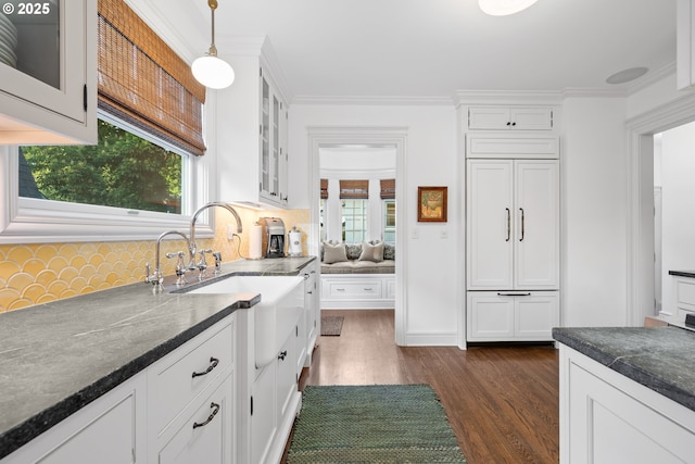 4108 NE 30th Ave Unit A & B, Portland, OR 97211 - kitchen with dark wood finished floors, a sink, white cabinetry, glass insert cabinets, and ornamental molding