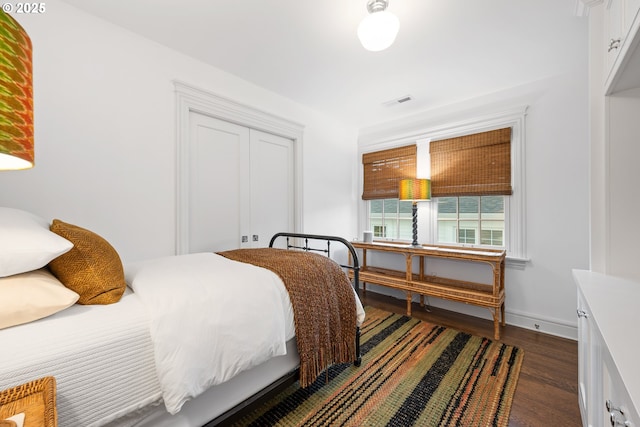 4108 NE 30th Ave Unit A & B, Portland, OR 97211 - bedroom featuring dark wood-style floors, a closet, and baseboards