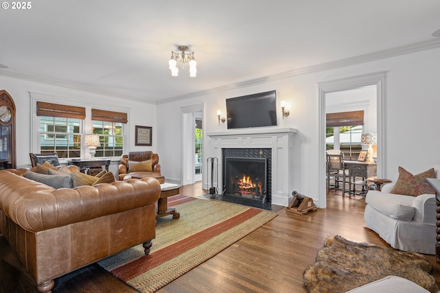 4108 NE 30th Ave Unit A & B, Portland, OR 97211 - living area featuring wood finished floors, ornamental molding, a fireplace, and plenty of natural light