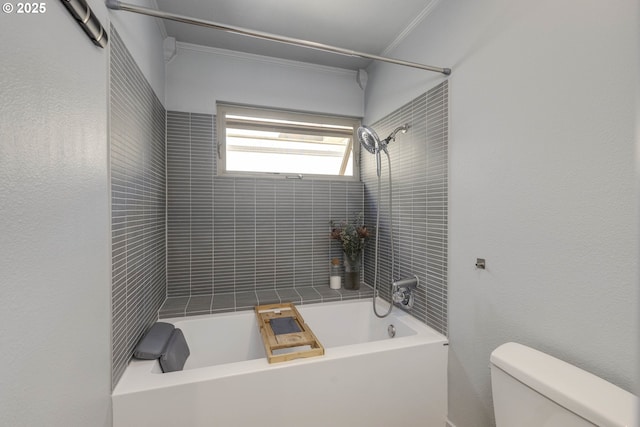 full bath featuring ornamental molding, toilet, and  shower combination