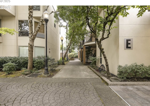 exterior space featuring stairway and street lighting