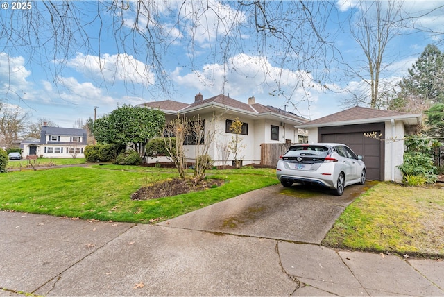 view of front of house with an outdoor structure, concrete driveway, a front yard, a garage, and a chimney