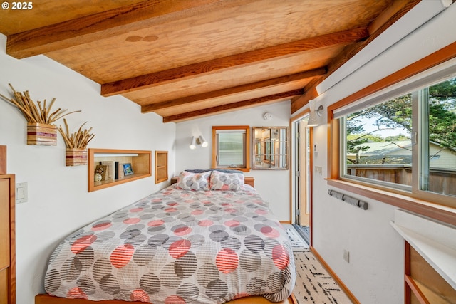 bedroom featuring lofted ceiling with beams