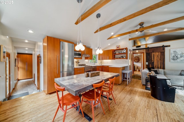dining space featuring recessed lighting, a barn door, light wood-style flooring, and lofted ceiling with beams