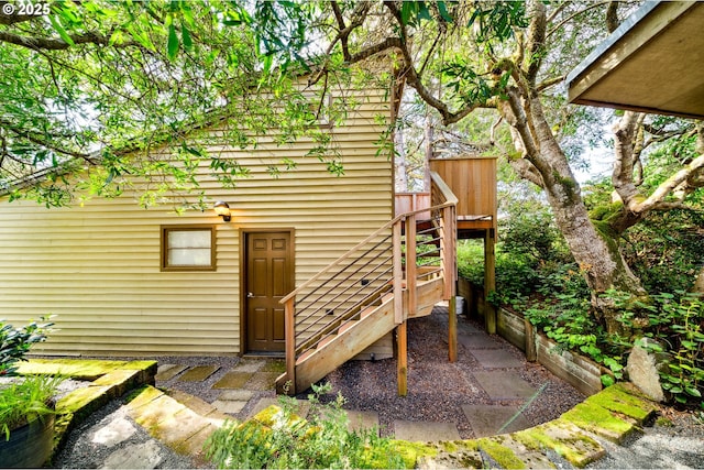 view of outbuilding featuring stairs