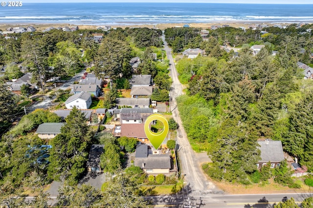 drone / aerial view with a residential view and a water view