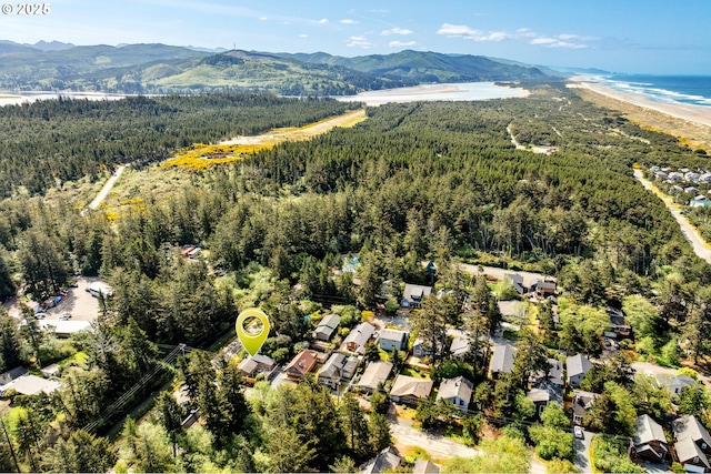 aerial view with a mountain view and a forest view
