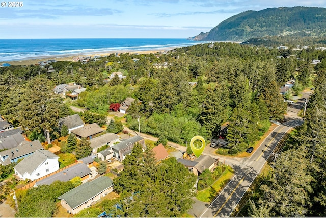 birds eye view of property featuring a water and mountain view
