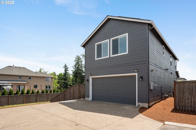 17085 SE Troge Rd, Happy Valley, OR 97086 - view of home's exterior with an attached garage and concrete driveway