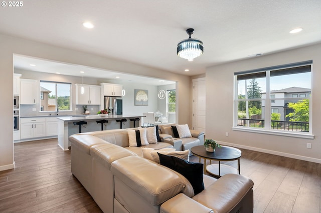 17085 SE Troge Rd, Happy Valley, OR 97086 - living area featuring light wood-style flooring and recessed lighting