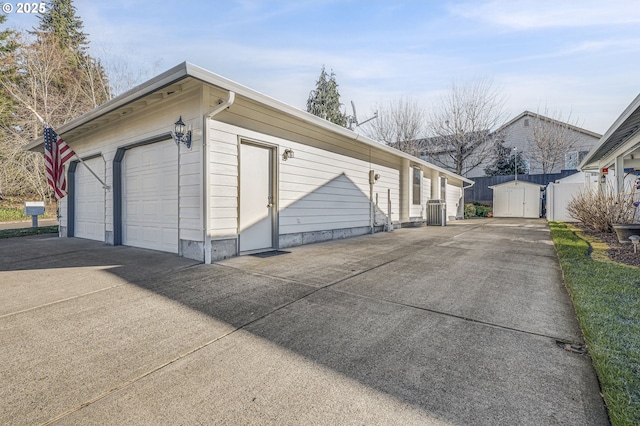 view of side of property featuring a shed and a garage