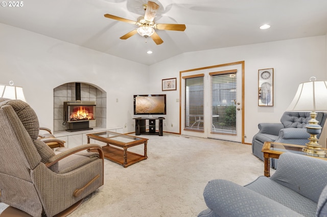 carpeted living room featuring vaulted ceiling and ceiling fan