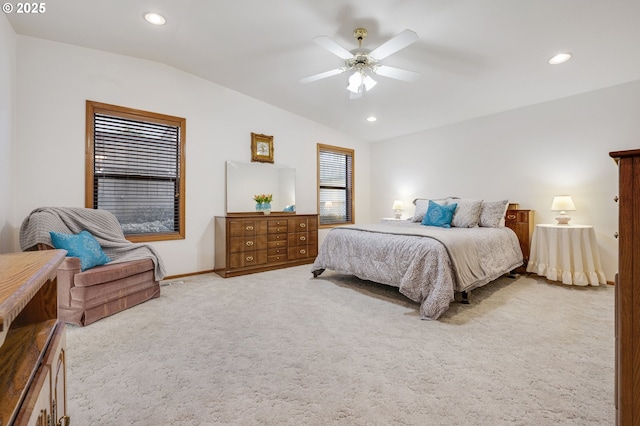 bedroom featuring lofted ceiling, light carpet, and ceiling fan