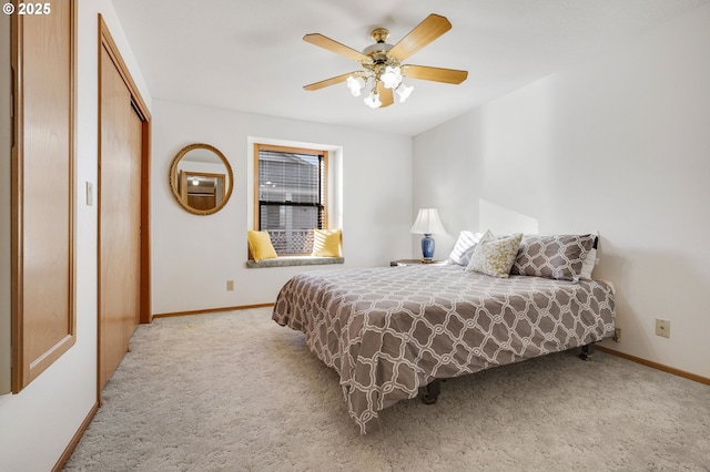 bedroom with carpet flooring, ceiling fan, and a closet