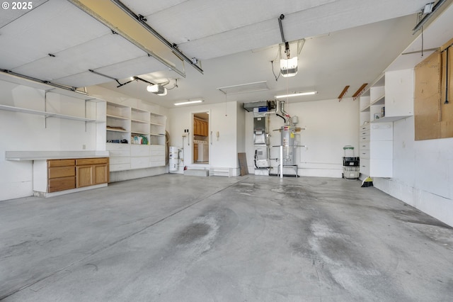 garage featuring a garage door opener and water heater