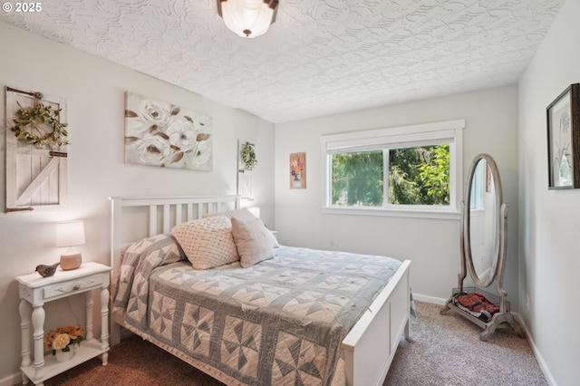 bedroom with carpet flooring and a textured ceiling