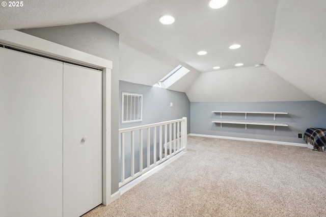 bonus room with vaulted ceiling, carpet, baseboards, recessed lighting, and a skylight