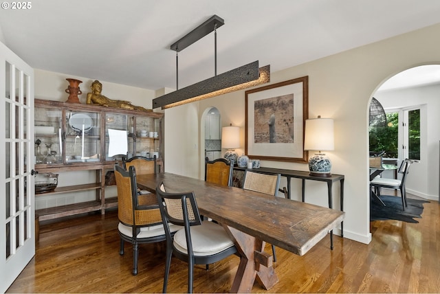2917 Westview Cir, Lake Oswego, OR 97034 - dining space with arched walkways and wood finished floors