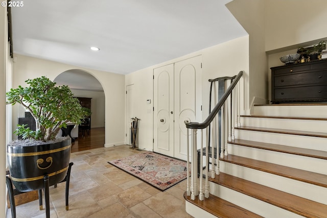 2917 Westview Cir, Lake Oswego, OR 97034 - foyer with arched walkways, stone tile floors, stairs, recessed lighting, and baseboards