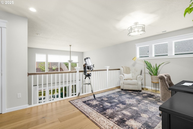 home office with visible vents, baseboards, wood finished floors, and recessed lighting