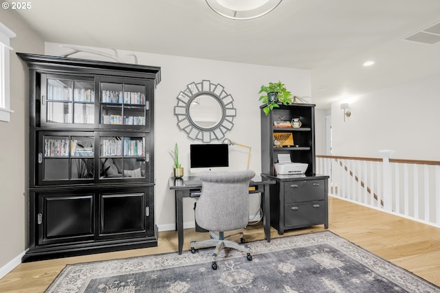 office area with recessed lighting, wood finished floors, and baseboards