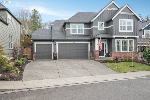 craftsman inspired home featuring brick siding, a shingled roof, fence, concrete driveway, and board and batten siding