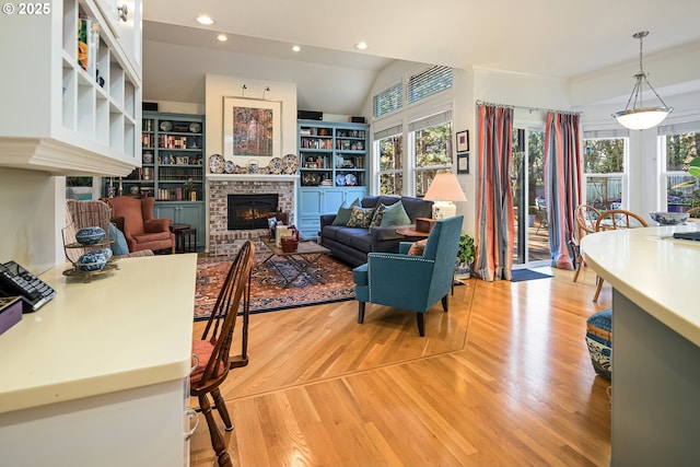 living room with a fireplace and light hardwood / wood-style floors